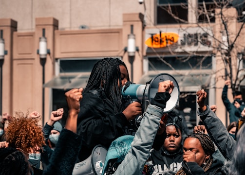 Protesters including one holding a megaphone