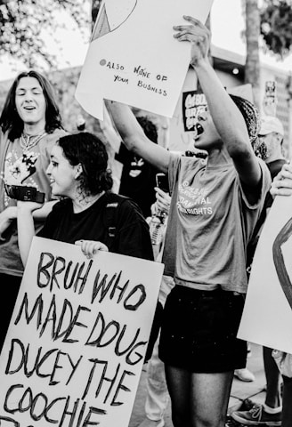 Protesters holding signs